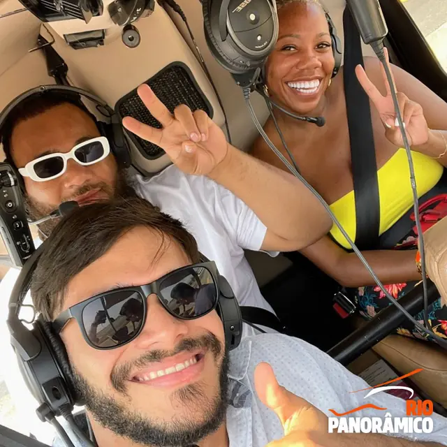 Passengers smiling on board the helicopter