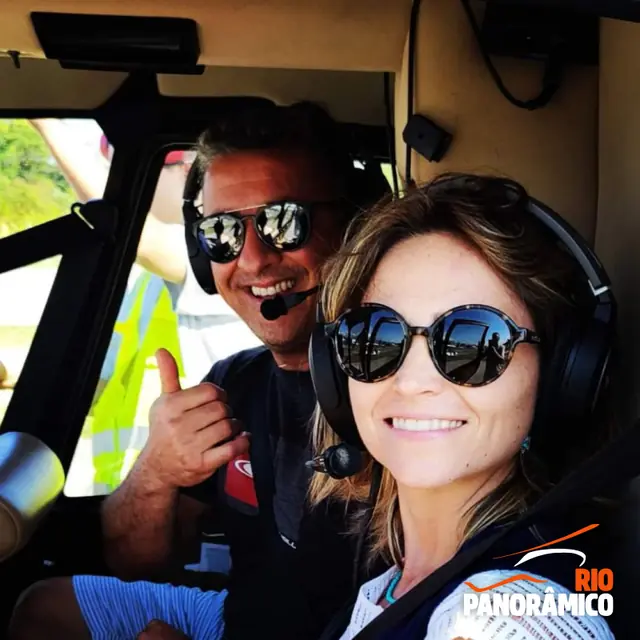Couple on board the helicopter with the pilot